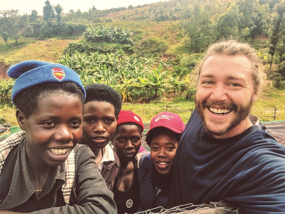 Young coffee farmers of the Gakombe Community posing for a selfie with Eric, the founder of CCR
